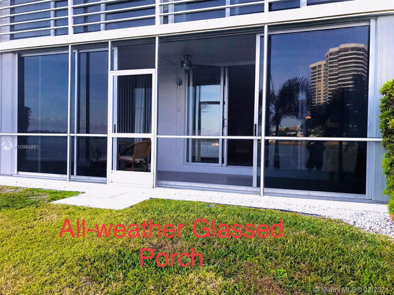 Front view of a building with an all-weather glassed porch.