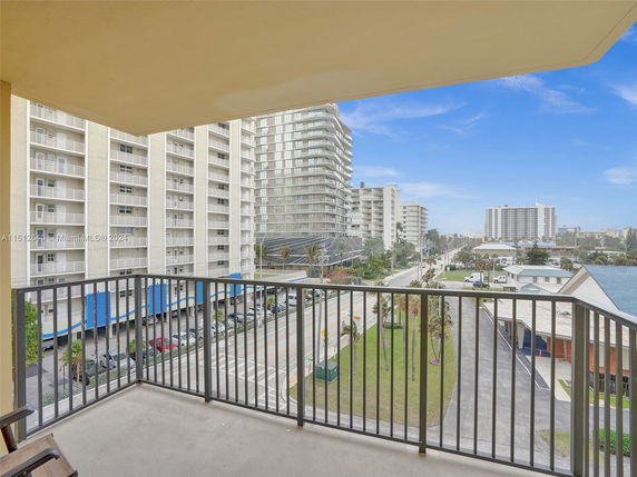 Balcony view of surrounding residential buildings and street