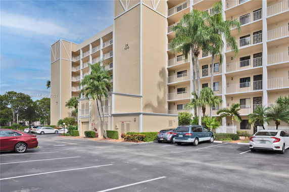 Front view of a multi-story residential building with balconies.