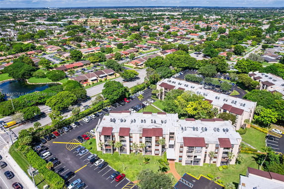 Aerial view of a residential area with multiple apartment buildings and surrounding neighborhood.