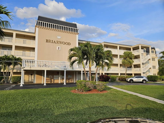 Front view of a multi-story building with balconies labeled Briarwood.