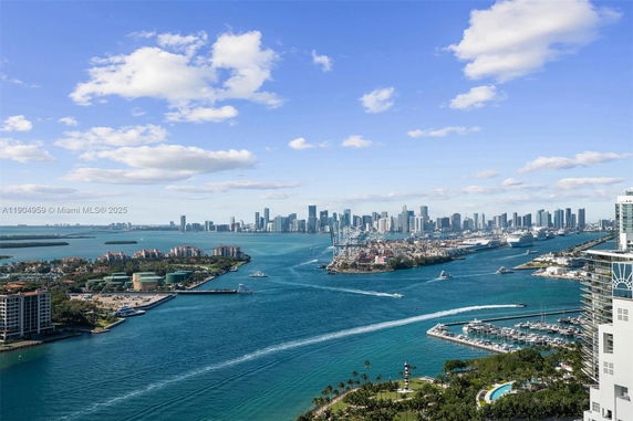 Panoramic view of a cityscape with waterways and high-rise buildings.