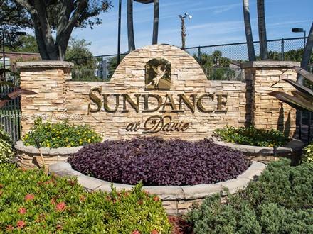 Entrance sign of Sundance at Davie with surrounding landscaping.