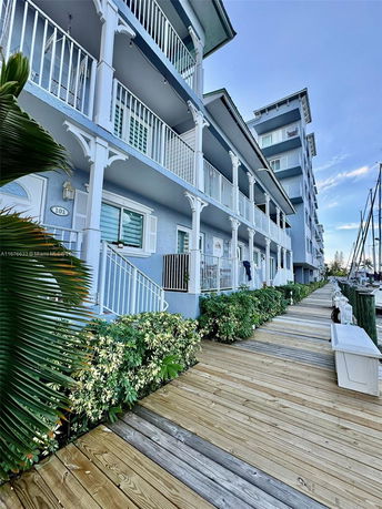 Front view of a multi-story building with balconies.
