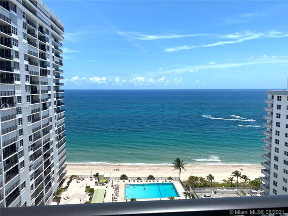 Wide angle view of ocean and beach from high-rise building