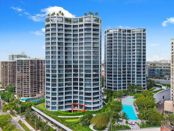 Front view of high-rise residential buildings with curved balconies.