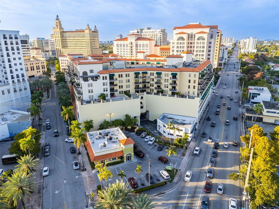Aerial view of urban area with multiple buildings and busy streets.