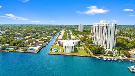 Aerial view of waterfront buildings and surrounding areas.
