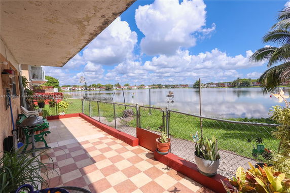 Outdoor patio with a view of the lake and surrounding neighborhood.