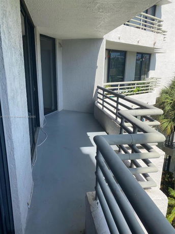 Balcony view from a multi-story building.