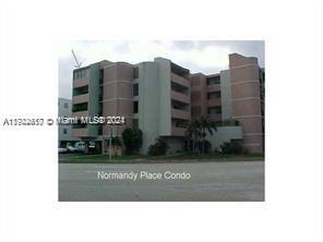 Front view of a multi-story condominium building.