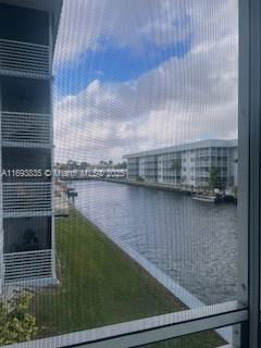 View of buildings and a water canal from a window.