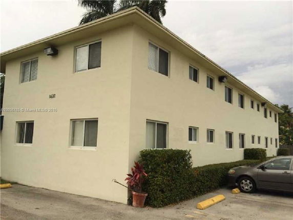 Front view of a two-story building with multiple windows.