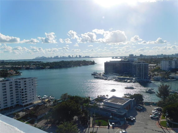 Panoramic view of waterway and buildings in the distance.