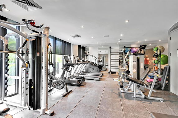 Interior view of a gym with various exercise equipment.