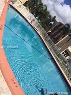 Outdoor swimming pool with safety fence.