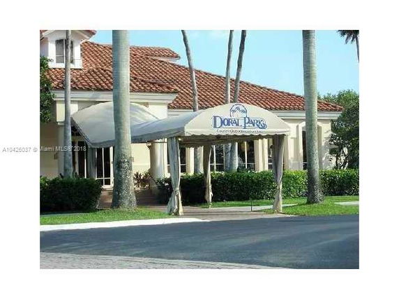 Front view of a building with a canopy and tiled roof.