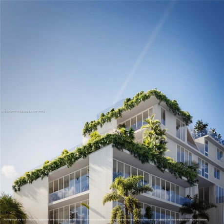 Front view of a multi-story building with greenery.