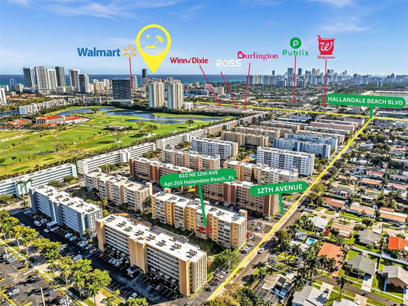 Wide-angle view of an urban area with residential buildings and commercial landmarks.