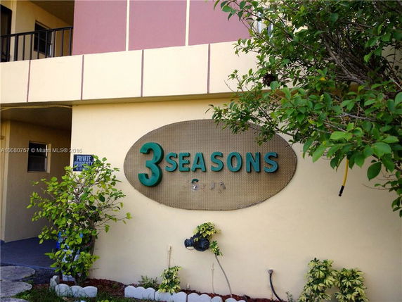 Front view of a building with a sign reading '3 Seasons'.