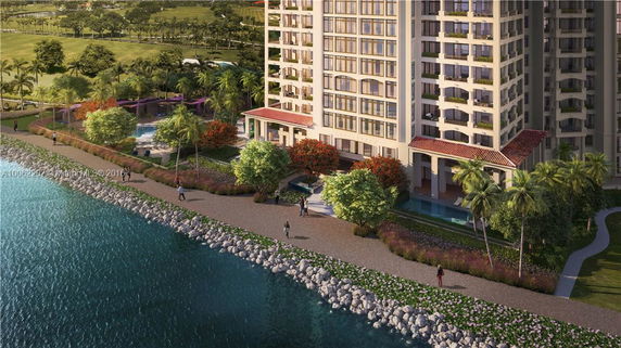 High-rise residential building with a waterfront pathway and surrounding greenery.