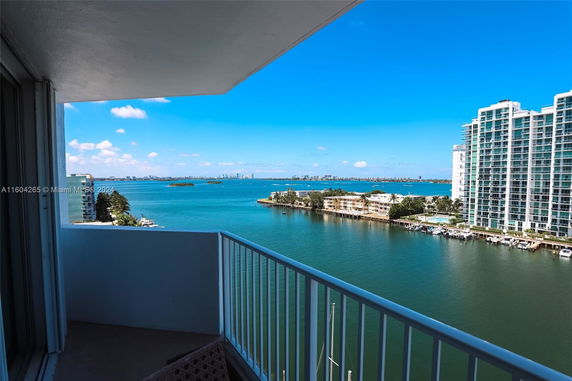 Panoramic view of a coastal area with high-rise buildings and water.