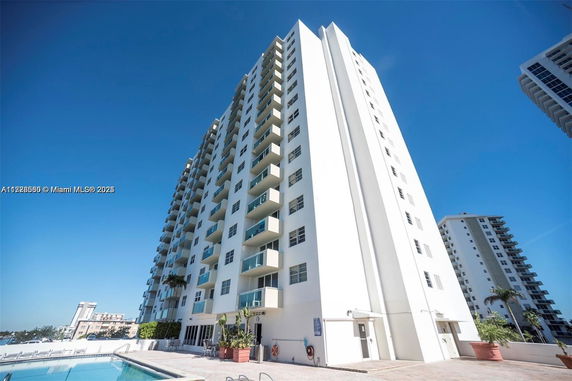 Front view of a high-rise building with multiple balconies
