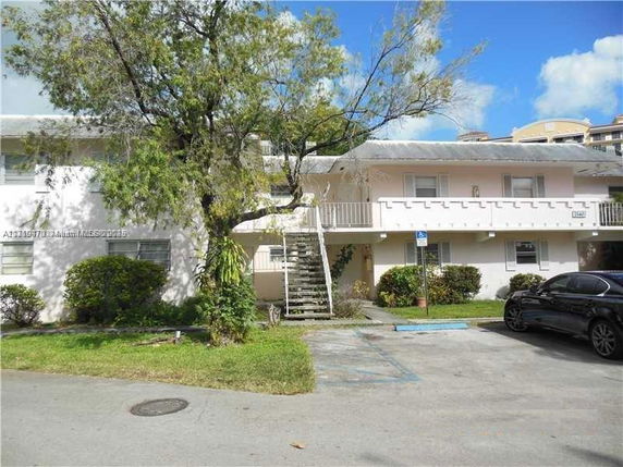 Front view of a two-story residential building with a central staircase.
