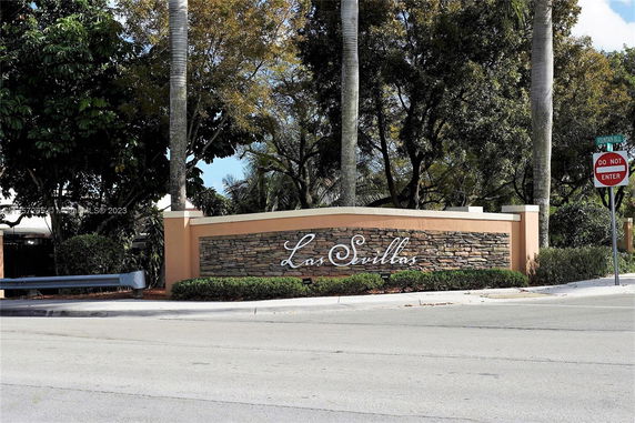 Entrance sign for a residential area named Las Sevillas.
