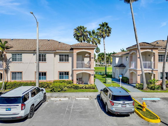 Front view of a two-story residential building with a tile roof.
