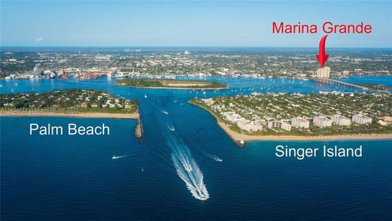 Aerial view of a coastal area with islands, water channels and buildings.