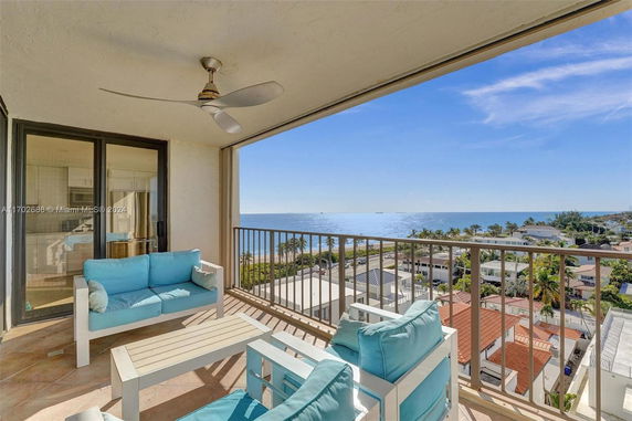 Balcony view overlooking the ocean and surrounding neighborhood.