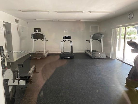 Indoor gym area with treadmills and exercise equipment.