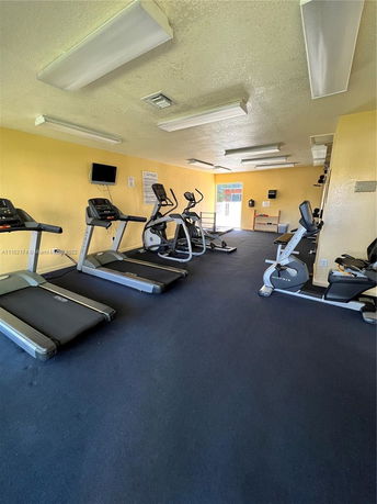 Indoor gym area with treadmills and exercise bikes.