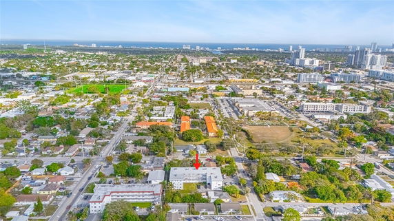 Panoramic view of a cityscape with residential and commercial buildings.