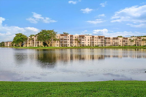 Lakeside view of multi-story apartment buildings