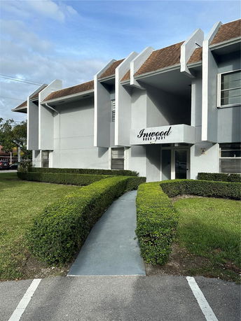 Front view of a two-story building with a modern design and prominent entrance.