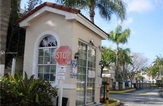 Small security booth with a stop sign in a gated community.