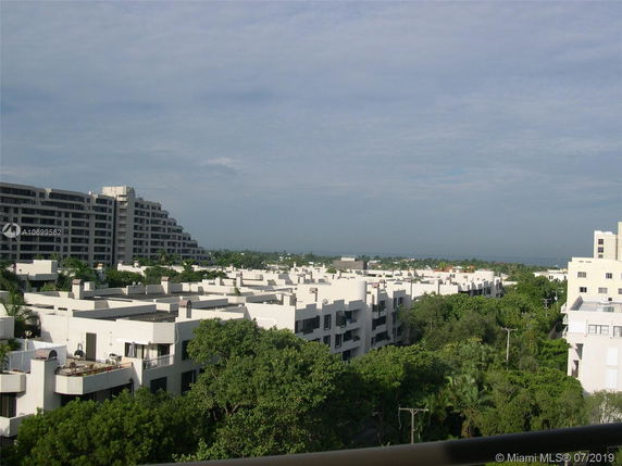 Panoramic view of multiple residential buildings with greenery around.