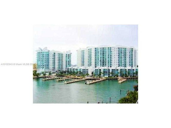 Front view of waterfront high-rise buildings.