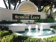 Sign with fountains for Sunrise Lakes Phase IV.