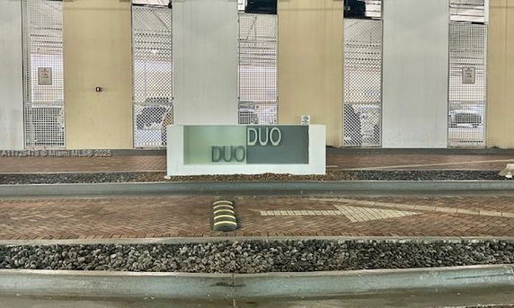 Covered parking area with a sign that reads 'DUO'.