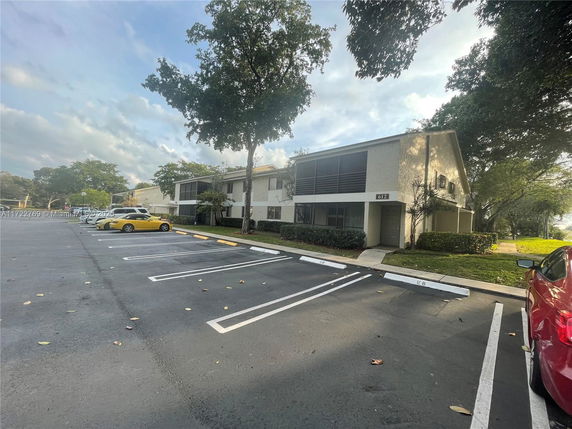 Parking area in front of a two-story building