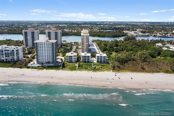 View of a coastal area with multiple tall beachfront buildings.