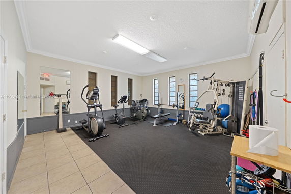 Indoor gym area with exercise equipment and large mirrors.