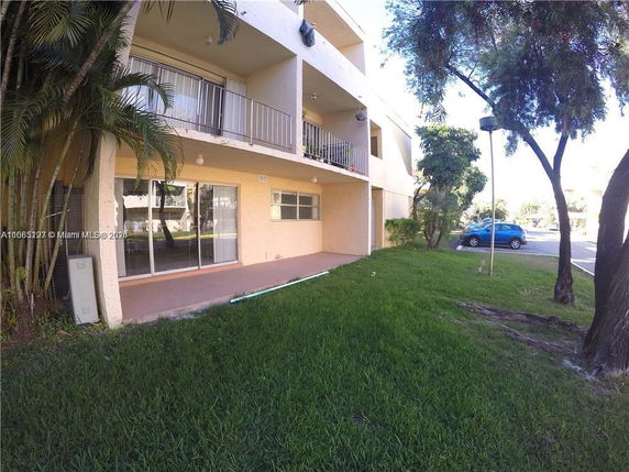 Front view of a multi-story building with balconies.