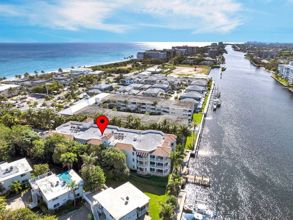 Panoramic aerial view of coastal residential area with waterways.