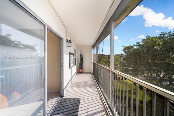 View from a screened balcony overlooking surroundings.