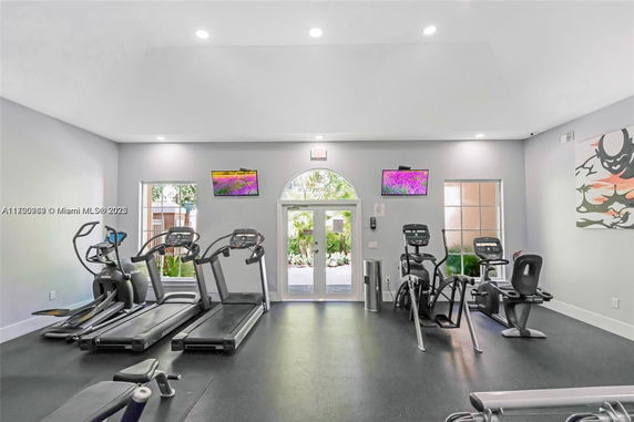 Indoor gym area with exercise equipment and natural lighting.
