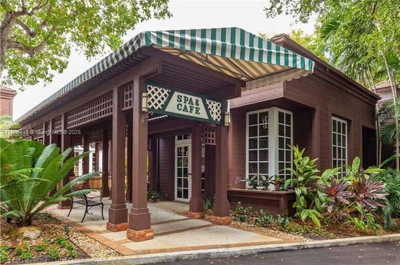 Front view of a building with a spa and cafe.